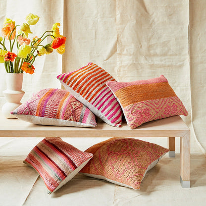 Intiearth_orange_pink_frazada_pillows_on_bench_flowers